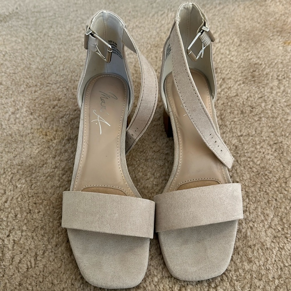 Neutral block heel sandals.